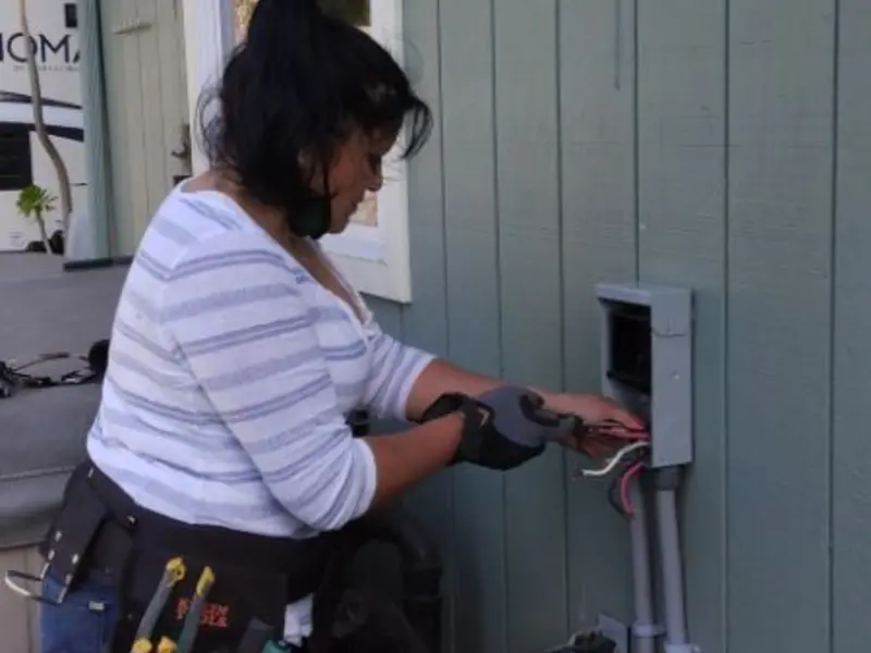 Licensed electrician wiring an exterior subpanel in Emerald Mountain
