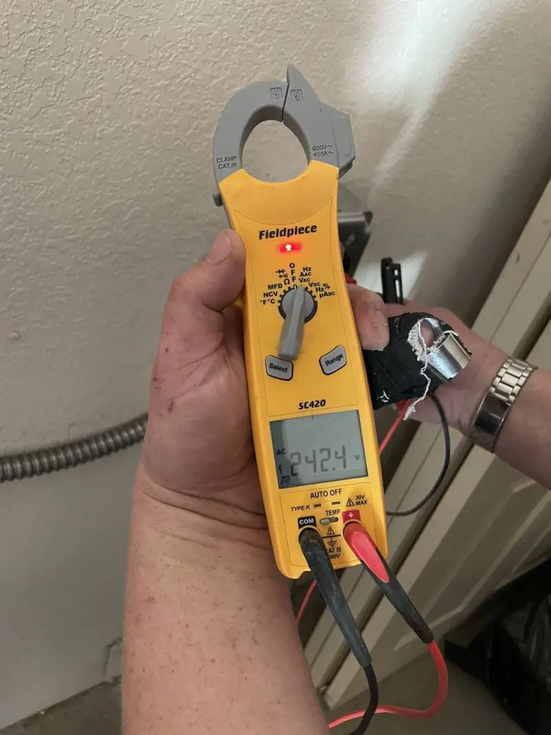 Voltage testing with clamp meter during Circuit Breaker Repair in Emerald Mountain